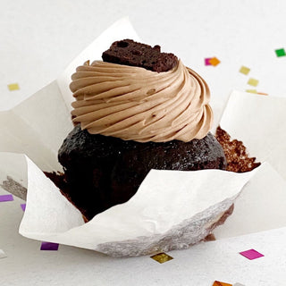 Chocolate cupcake topped with chocolate swiss meringue buttercream and a mini brownie.