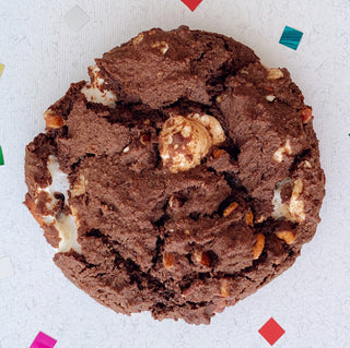 Vegan chocolate cookie stuffed with pecans and vegan marshmallows.