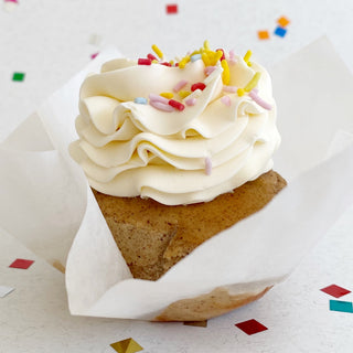 Smash Cinnamon Banana Cupcake topped with vanilla swiss meringue buttercream and colourful sprinkles.