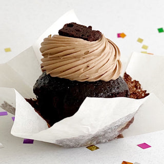 Chocolate cupcake with chocolate swiss meringue buttercream and topped with a mini brownie.